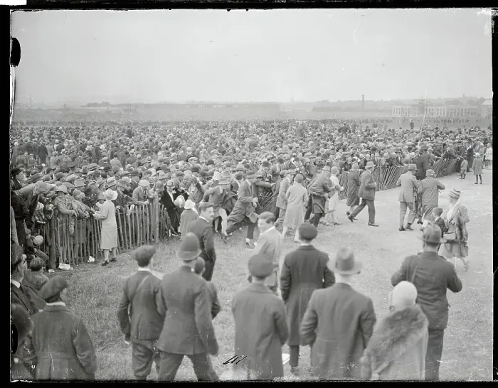 Framed Print : Large Crowd Standing at Fence Barrier Framed Print : Large Crowd Standing at Fence Barrier