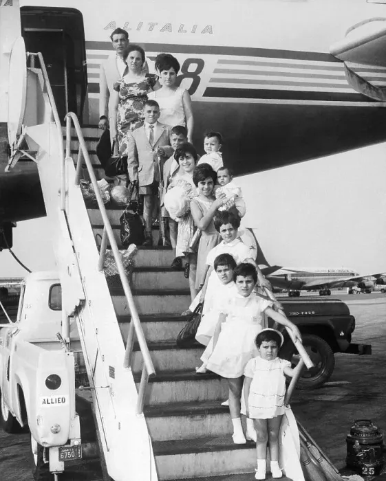 Framed Print : Large Family Stepping off an Airplane Framed Print : Large Family Stepping off an Airplane
