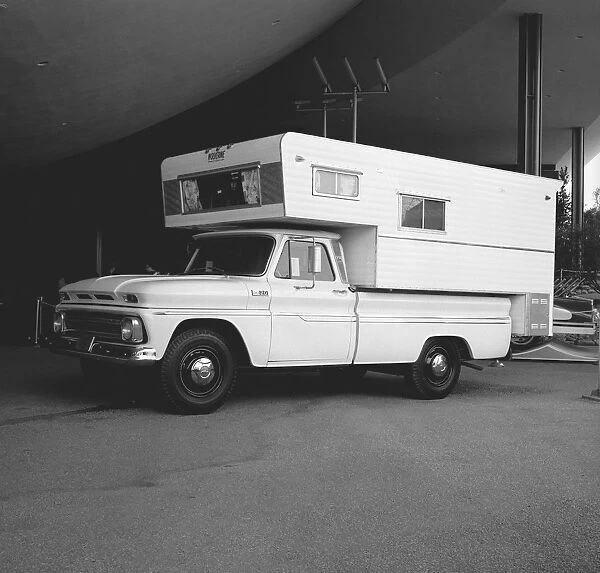 Large motor home in parking lot, (B&W)