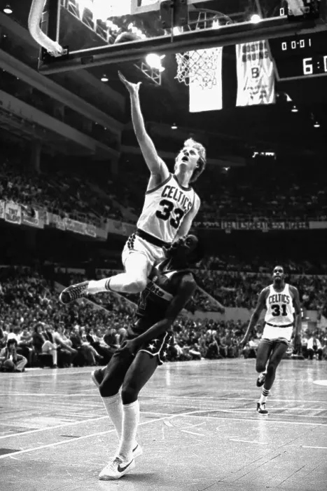 Framed Print : Larry Bird Climbing on Player to Score Framed Print : Larry Bird Climbing on Player to Score