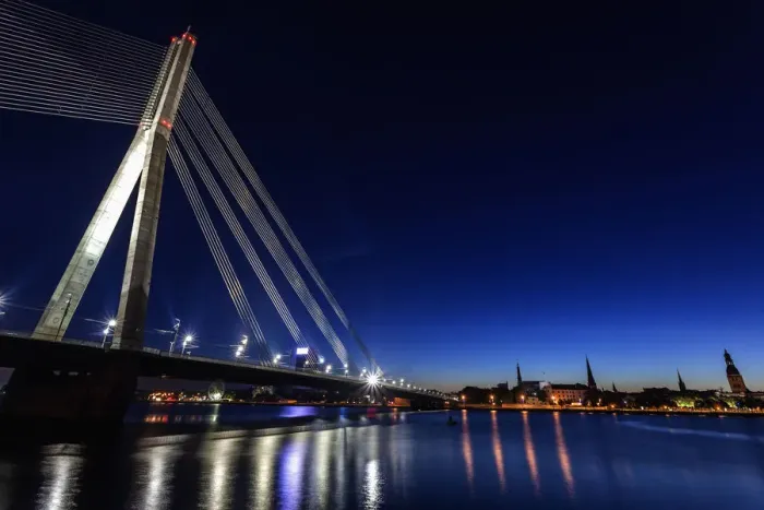 Framed Print : Latvia, Riga, River Daugava, Illuminated Vansu Bridge reflecting in river