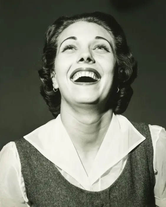 Framed Print : Laughing woman posing in studio, (B&W), portrait Framed Print : Laughing woman posing in studio, (B&W), portrait