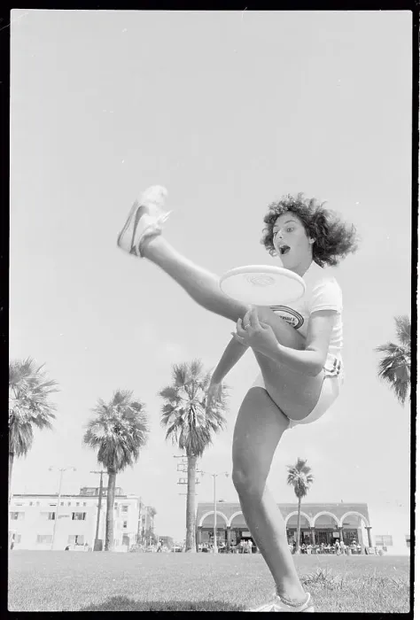 Framed Print : Laura Engel Catching Frisbee Through Her Legs Framed Print : Laura Engel Catching Frisbee Through Her Legs