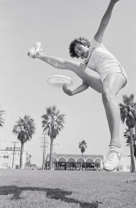 Framed Print : Laura Engel Catching Frisbee Through Her Legs Framed Print : Laura Engel Catching Frisbee Through Her Legs