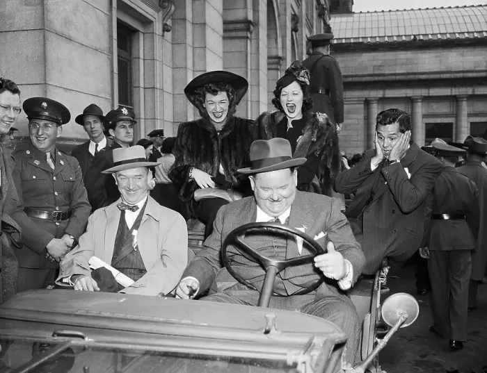Framed Print : Laurel, Hardy, Others Around Army Jeep
