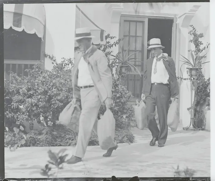 Framed Print : Law Enforcement Officers Carrying Bags from Al Capone's Home Framed Print : Law Enforcement Officers Carrying Bags from Al Capone's Home