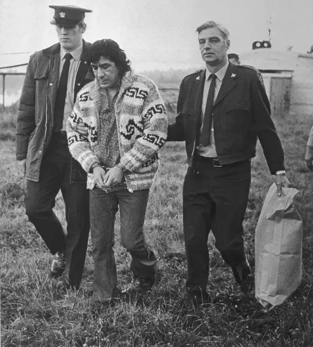 Framed Print : Law Enforcement Officers with a Handcuffed Leonard Peltier Framed Print : Law Enforcement Officers with a Handcuffed Leonard Peltier