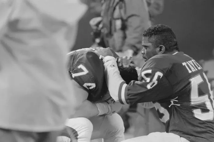 Framed Print : Lawrence Taylor Talking with Eric Howard on Bench Framed Print : Lawrence Taylor Talking with Eric Howard on Bench