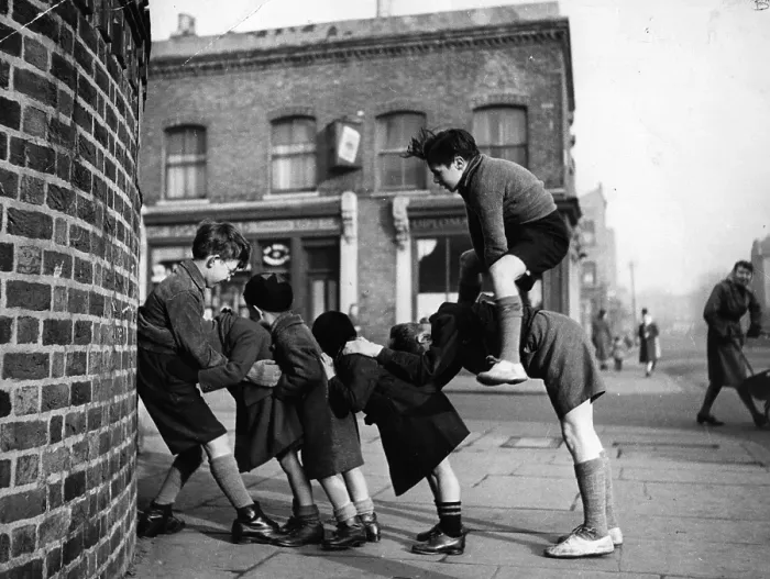 Framed Print : Leap-Frog. Children playing games in the street Framed Print : Leap-Frog. Children playing games in the street