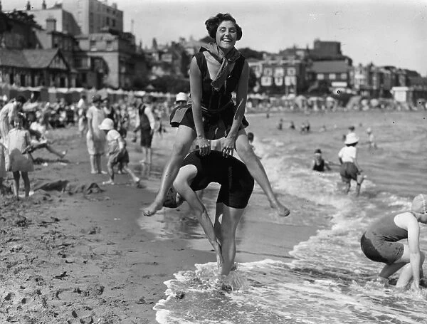 Leapfrog. July 1927: Two women playing leapfrog on the beach at Broadstairs in Kent