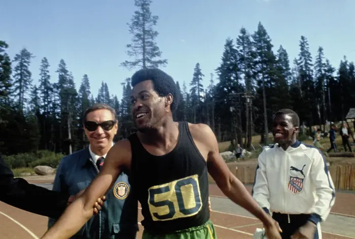 Framed Print : Lee Evans. American sprinter Lee Evans (1947 - 2021) smiling after winning Framed Print : Lee Evans. American sprinter Lee Evans (1947 - 2021) smiling after winning