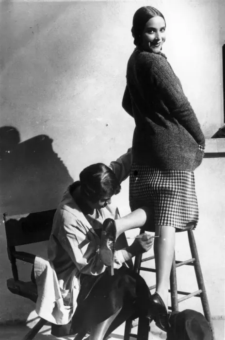 Framed Print : Leg Seams. 1926: A woman having a seam painted onto her leg Framed Print : Leg Seams. 1926: A woman having a seam painted onto her leg