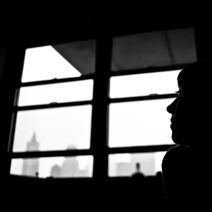 Framed Print : Leicadom. Silhouette of a woman in a Manhattan apartment with hints of