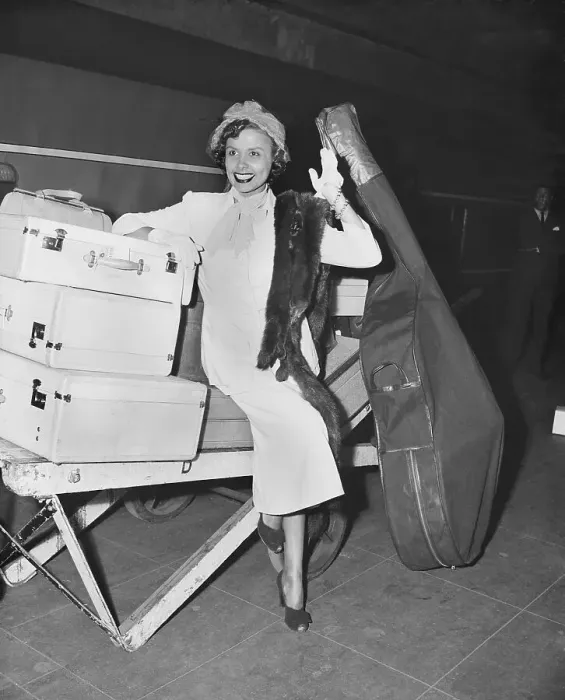 Framed Print : Lena Horne Sits On Luggage And Waves Framed Print : Lena Horne Sits On Luggage And Waves