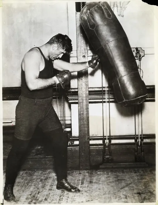 Framed Print : Full Length Jess Willard Punches Bag