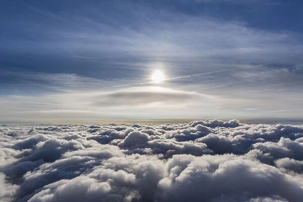 Lenticular cloud, Cumulus lenticularis, above the top layer of clouds, North Rhine-Westphalia, Germany