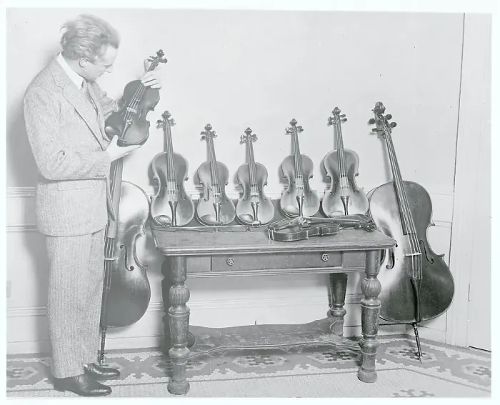 Framed Print : Leopold Stokowski Inspecting Rare Violins Framed Print : Leopold Stokowski Inspecting Rare Violins