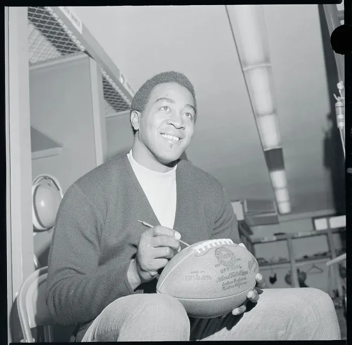 Framed Print : Leroy Kelly Autographing a Football Framed Print : Leroy Kelly Autographing a Football