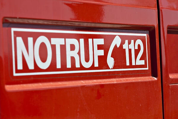 Lettering, Notruf 112, the German emergency telephone number on a fire engine, Germany, Europe