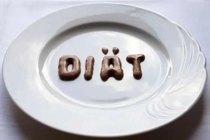Framed Print : Letters forming the word diaet, German for diet made from Russian bread on a white plate