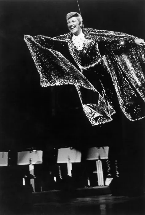 Framed Print : Liberace. Flying over the music stands of the orchestra Framed Print : Liberace. Flying over the music stands of the orchestra