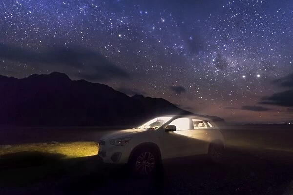 a lid up car in a starry sky