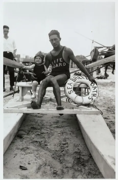 Framed Print : Life Guard Posing with Infant Framed Print : Life Guard Posing with Infant