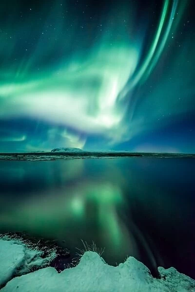 Light my fire. Aurora Borealis, Northern lights Thingvellir national park Iceland