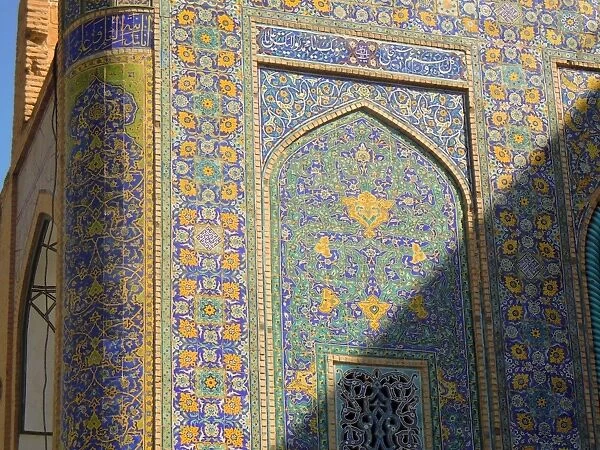 Light and shadow on colorful Islamic design of the Imam mosque - Isfahan, Iran
