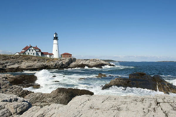 Lighthouse, waves breaking on rocks, Portland Head Light, Cape Elizabeth, Portland, Maine, New England, USA, North America