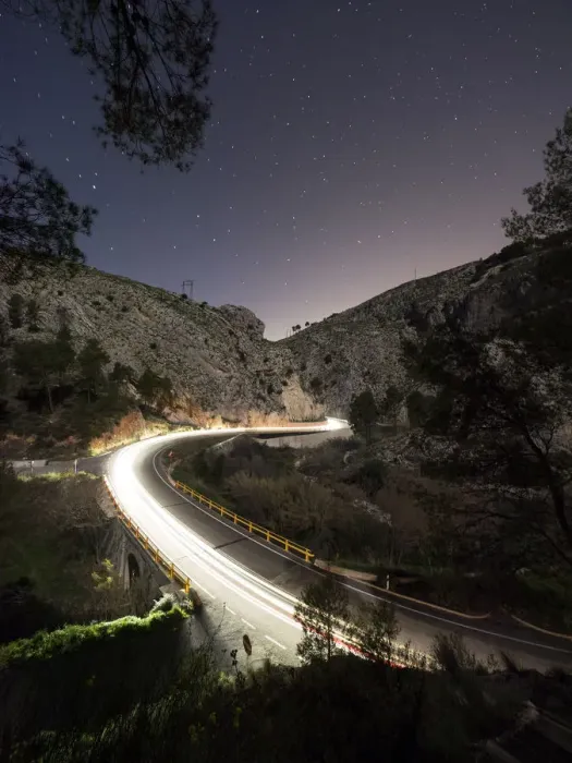 Framed Print : Lights of vehicles circulating along a road with curves during the night