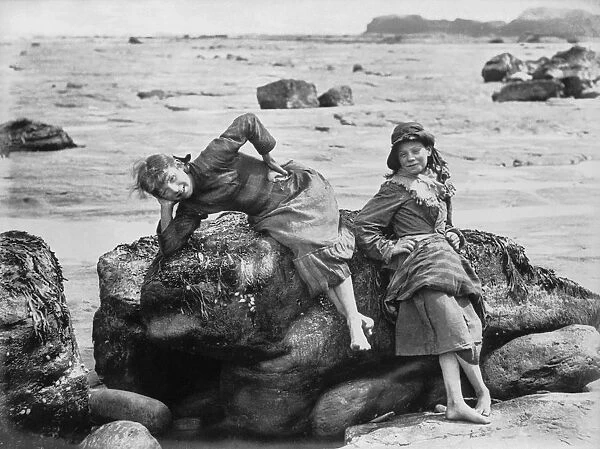 Limpets. Two girls on the rocks by the sea. (Photo by Frank Meadow Sutcliffe / Getty Images)