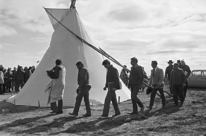 Framed Print : Line Of Men Walking Outside Teepee