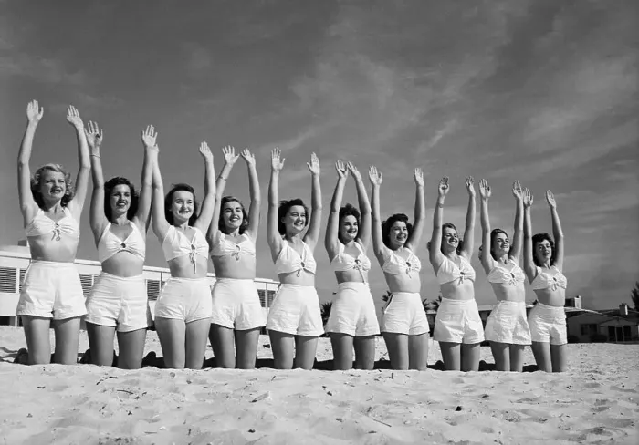 Framed Print : Line Of Woman On Beach With Arms Raised Framed Print : Line Of Woman On Beach With Arms Raised