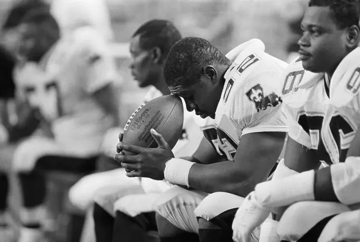 Framed Print : Linebacker Deep in Thought on Sidelines Framed Print : Linebacker Deep in Thought on Sidelines