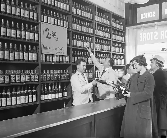 Framed Print : Liquor Store Clerks Helping Customers Make Purchases Framed Print : Liquor Store Clerks Helping Customers Make Purchases