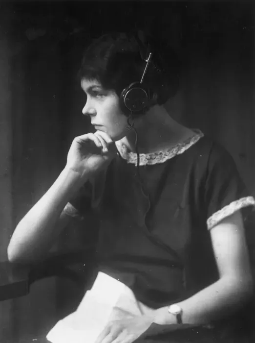 Framed Print : Listener. circa 1930: A girl wearing headphones Framed Print : Listener. circa 1930: A girl wearing headphones