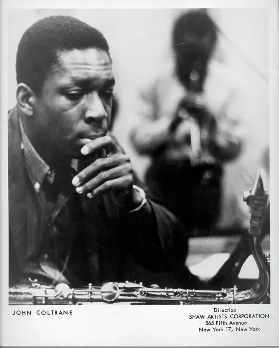 Framed Print : Listening. CIRCA 1961: Jazz saxophonist John Coltrane listens as a man Framed Print : Listening. CIRCA 1961: Jazz saxophonist John Coltrane listens as a man
