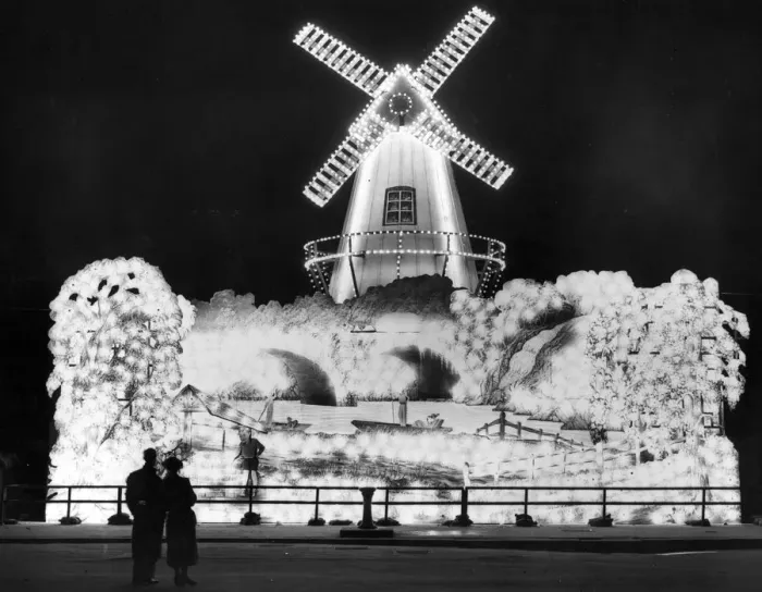 Framed Print : Well Lit. Visitors admiring the windmill, one of the illuminations at Blackpool Framed Print : Well Lit. Visitors admiring the windmill, one of the illuminations at Blackpool