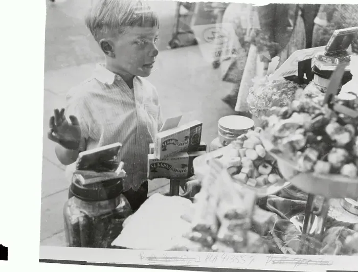 Framed Print : Little Boy Looking Into a Candy Shop Framed Print : Little Boy Looking Into a Candy Shop