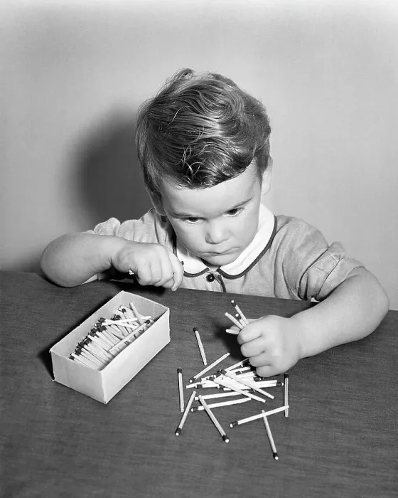 Framed Print : Little Boy Playing with Matches Framed Print : Little Boy Playing with Matches