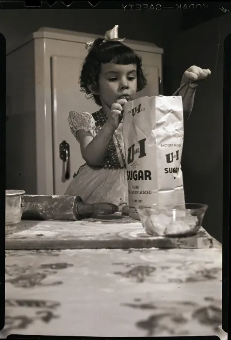 Framed Print : Little Girl Scooping Sugar for Baking Framed Print : Little Girl Scooping Sugar for Baking