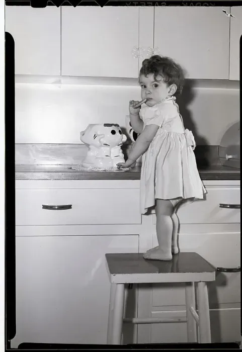 Framed Print : Little Girl Sneaking a Cookie from Cookie Jar
