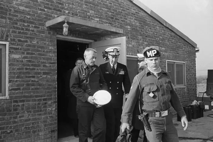 Framed Print : Lloyd Bucher Leaving with MP and Navy Captain Framed Print : Lloyd Bucher Leaving with MP and Navy Captain