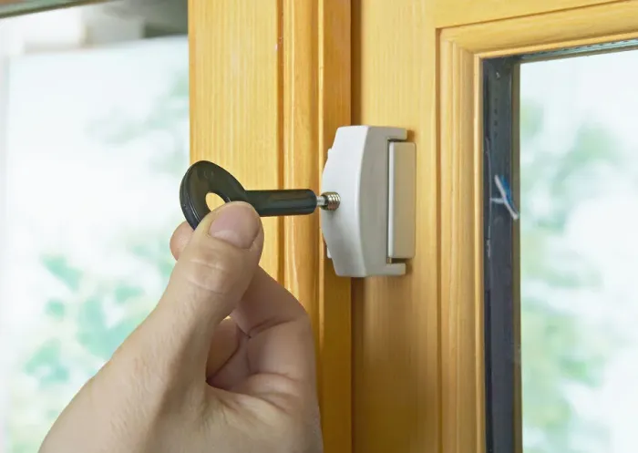 Framed Print : Locking casement window lock with the key Framed Print : Locking casement window lock with the key