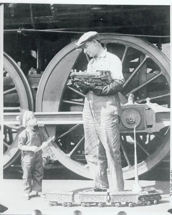 Framed Print : Locomotive Engineer Holding Model Train Framed Print : Locomotive Engineer Holding Model Train
