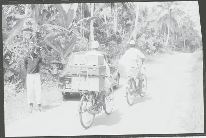 Framed Print : Lone Traveler with Car and Refugee Bicyclists Passing on Highway Framed Print : Lone Traveler with Car and Refugee Bicyclists Passing on Highway