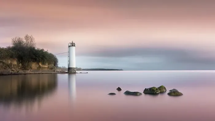 Framed Print : Long exposure of a colourful sunset behind the abandoned lighthouse on the Baltic Sea coast in Maltzien on Ruegen, Germany, Europe Framed Print : Long exposure of a colourful sunset behind the abandoned lighthouse on the Baltic Sea coast in Maltzien on Ruegen, Germany, Europe