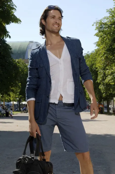 Framed Print : Long-haired man shopping in a city in the summer