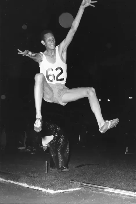 Framed Print : Long Jump. H Visser in the midst of his winning jump at White City, west London Framed Print : Long Jump. H Visser in the midst of his winning jump at White City, west London